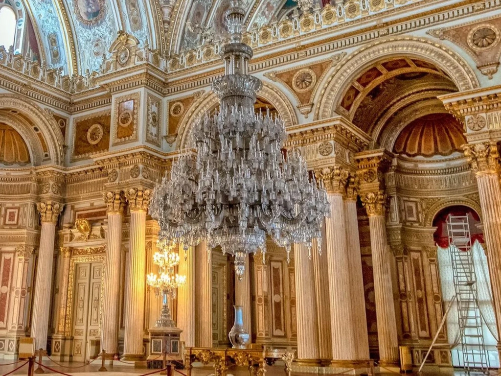 Ornate ceremonial hall with a crystal chandelier